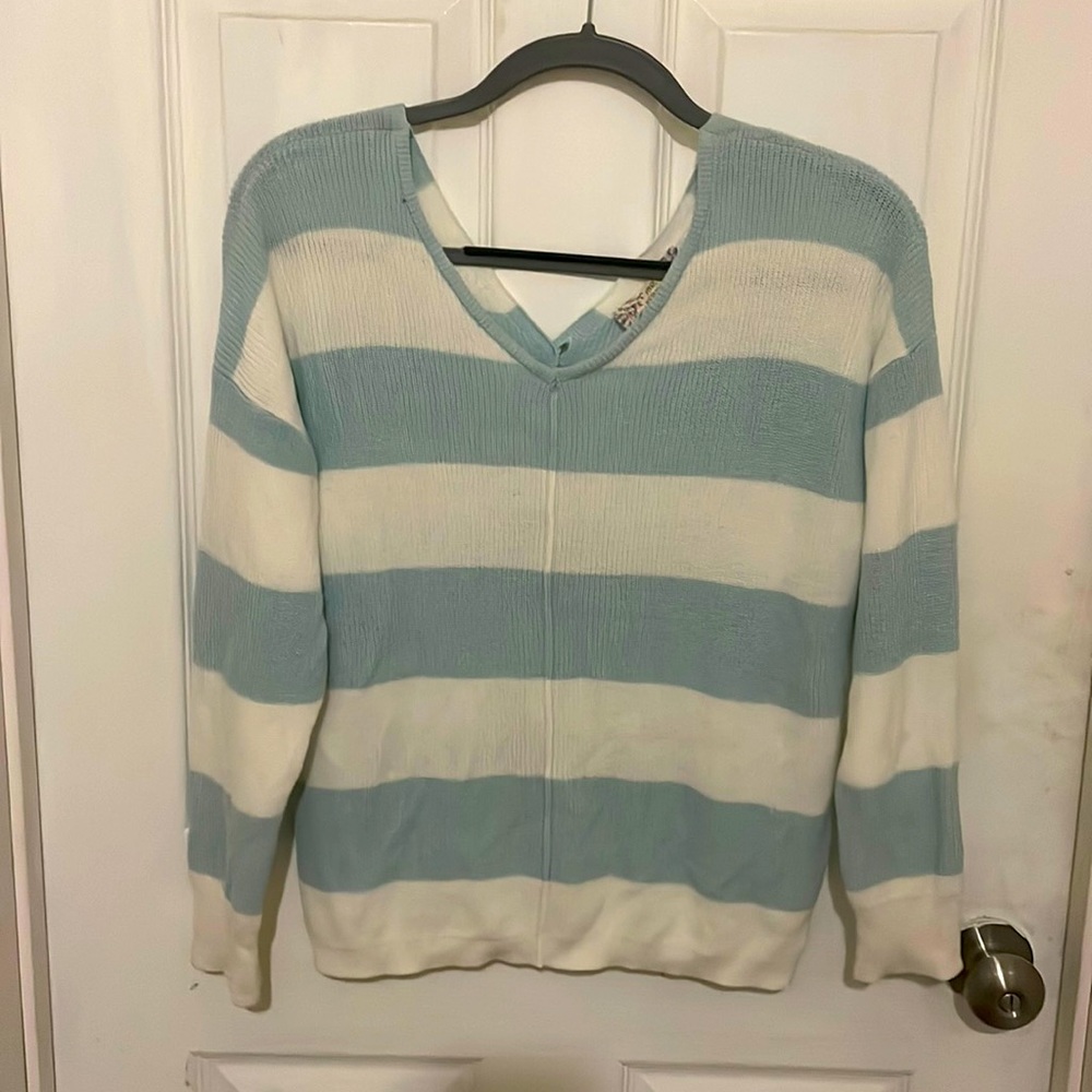 Cute sweater buttons down the back